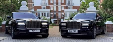 2 black Rolls-Royce Phantom cars